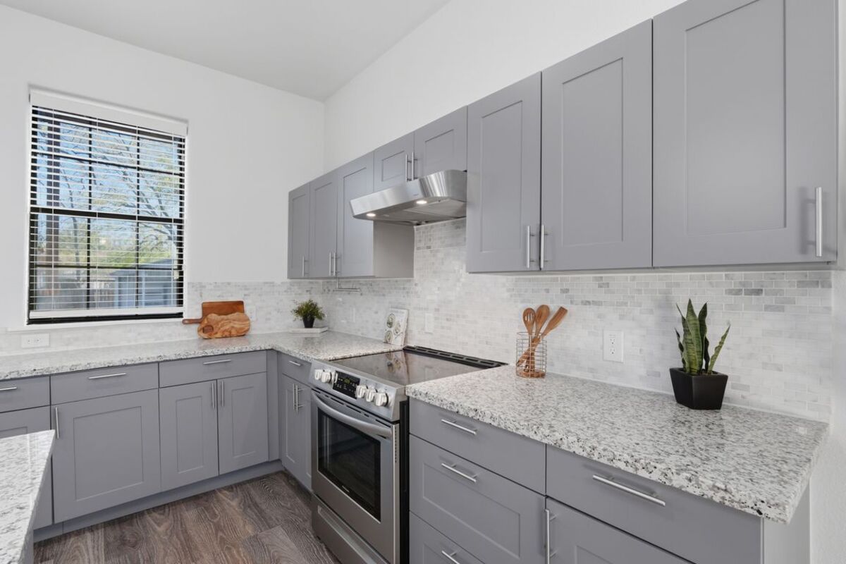 Kitchen counters, range and subway tile