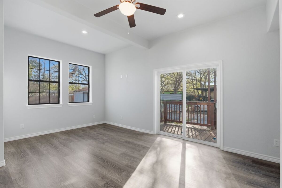 Bedroom with door to the rear deck